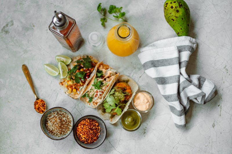 Shrimp tacos with avocado and citrus slaw