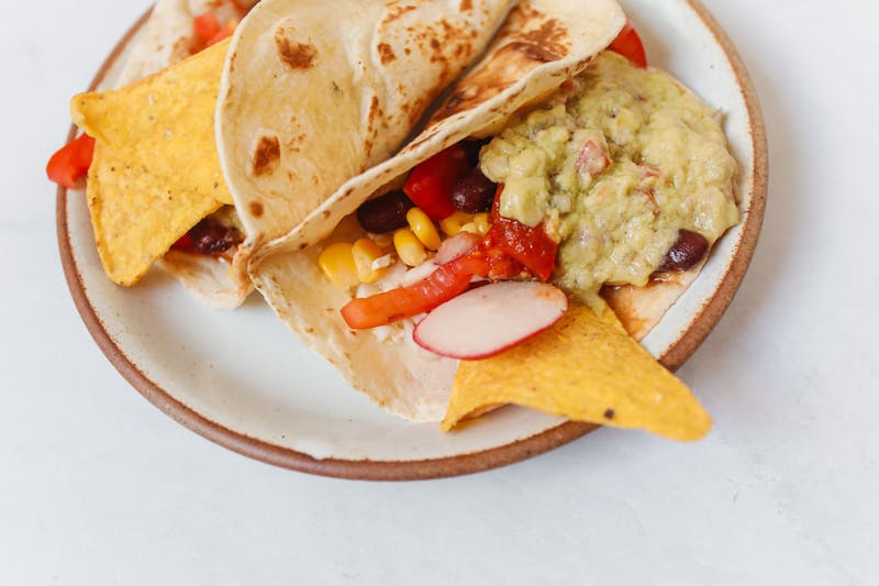 Veggie tacos with roasted peppers and guacamole